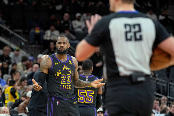Dec 15, 2023; San Antonio, Texas, USA; Los Angeles Lakers guard LeBron James (23) argues a call with official JB DeRosa (22) during the first half against the San Antonio Spurs at Frost Bank Center.